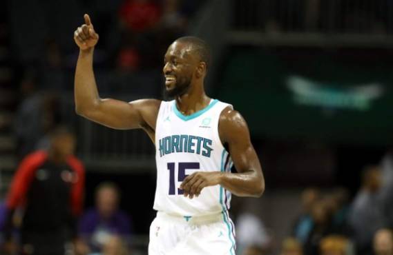 CHARLOTTE, NC - OCTOBER 08: Kemba Walker #15 of the Charlotte Hornets reacts after a play against the Chicago Bulls during their game at Spectrum Center on October 8, 2018 in Charlotte, North Carolina. NOTE TO USER: User expressly acknowledges and agrees that, by downloading and or using this photograph, User is consenting to the terms and conditions of the Getty Images License Agreement. Streeter Lecka/Getty Images/AFP