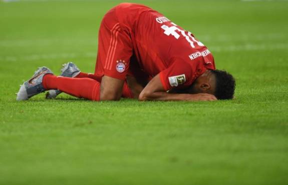 Bayern Munich's French midfielder Corentin Tolisso reacts after a foul during the German First division Bundesliga football match FC Bayern Munich v Hertha Berlin in Munich, southern Germany, on August 16, 2019. (Photo by Christof STACHE / AFP) / DFL REGULATIONS PROHIBIT ANY USE OF PHOTOGRAPHS AS IMAGE SEQUENCES AND/OR QUASI-VIDEO