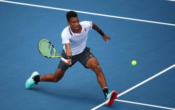 MIAMI GARDENS, FLORIDA - MARCH 29: Felix Auger-Aliassime of Canada in action against John Isner of USA in the semi final during day twelve of the Miami Open tennis on March 29, 2019 in Miami Gardens, Florida. Julian Finney/Getty Images/AFP