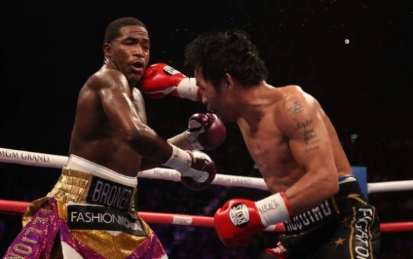 LAS VEGAS, NEVADA - JANUARY 19: Manny Pacquiao (R) throws a right on Adrien Broner during the WBA welterweight championship at MGM Grand Garden Arena on January 19, 2019 in Las Vegas, Nevada. Christian Petersen/Getty Images/AFP
