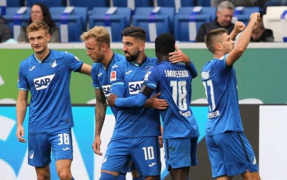 Hoffenheim's Croatian forward Andrej Kramaric (R) celebrates scoring the 3-1 with his teammates during the German first division Bundesliga football match TSG 1899 Hoffenheim v FC Bayern Munich on September 27, 2020 in Mainz, southern Germany. (Photo by Daniel ROLAND / AFP) / DFL REGULATIONS PROHIBIT ANY USE OF PHOTOGRAPHS AS IMAGE SEQUENCES AND/OR QUASI-VIDEO
