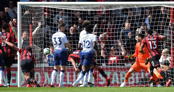 Tottenham Hotspur's French goalkeeper Hugo Lloris (2R) watches the ball into his net as Bournemouth's Dutch defender Nathan Ake (4L) scores the opening goal during the English Premier League football match between Bournemouth and Tottenham Hotspur at the Vitality Stadium in Bournemouth, southern England on May 4, 2019. (Photo by Ben STANSALL / AFP) / RESTRICTED TO EDITORIAL USE. No use with unauthorized audio, video, data, fixture lists, club/league logos or 'live' services. Online in-match use limited to 120 images. An additional 40 images may be used in extra time. No video emulation. Social media in-match use limited to 120 images. An additional 40 images may be used in extra time. No use in betting publications, games or single club/league/player publications. /