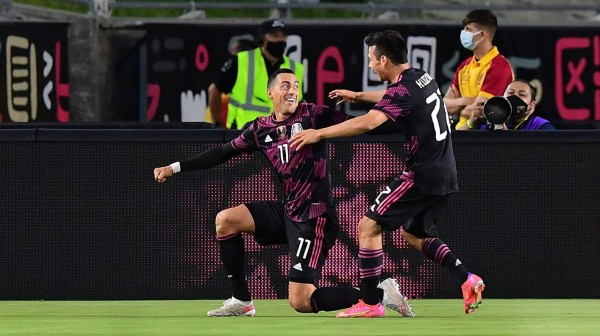 Mexico's Rogelio Funes Mori (L) celebrates with Hirving Lozano after scoring against Nigeria during an exhibition football match at the Los Angeles Memorial Coliseum in Los Angeles, California on July 3, 2021. (Photo by Frederic J. BROWN / AFP)