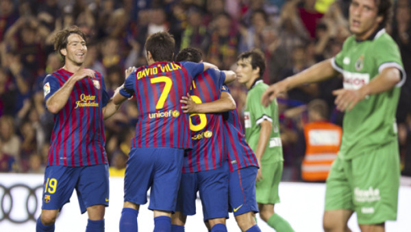 Messi guía al Barcelona a la cima