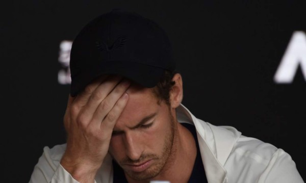 Britain's Andy Murray addresses media representatives at a press conference after defeat in his first round men's singles match against Spain's Roberto Bautista Agut on day one of the Australian Open tennis tournament in Melbourne early January 15, 2019. (Photo by Greg Wood / AFP) / -- IMAGE RESTRICTED TO EDITORIAL USE - STRICTLY NO COMMERCIAL USE --