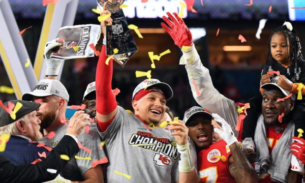 Feb 2, 2020; Miami Gardens, Florida, USA; Kansas City Chiefs quarterback Patrick Mahomes (15) hoist the Vince Lombardi Trophy after defeating the San Francisco 49ers in Super Bowl LIV at Hard Rock Stadium. Mandatory Credit: Robert Deutsch-USA TODAY Sports